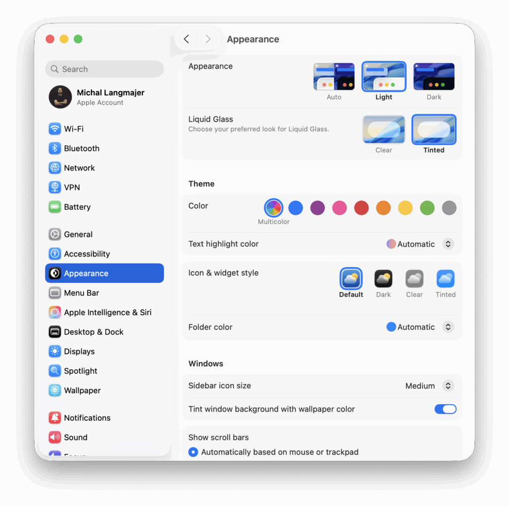 Screenshot of macOS Tahoe System Settings on the Appearance page, showing options for Light and Dark modes, Liquid Glass clear or tinted styles, color theme, icon and widget style, folder color, and window settings such as sidebar icon size and tinting windows with the wallpaper color.